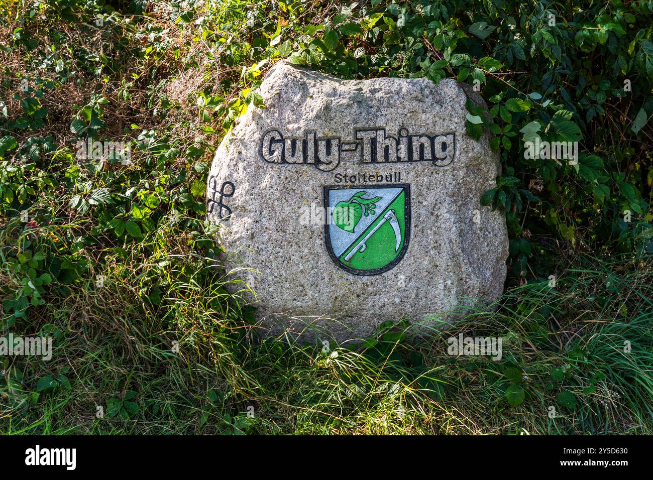 Memorial stone with inscription Guly Thing and coat of arms. Guly Thing. The Gulde Thing site is a reminder of Viking culture. Kirchenweg, Geltinger Bucht, Schleswig-Holstein, Schleswig-Holstein, Germany Stock Photo