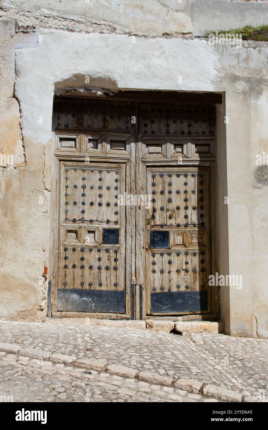 Old wooden door in Chinchón Stock Photo