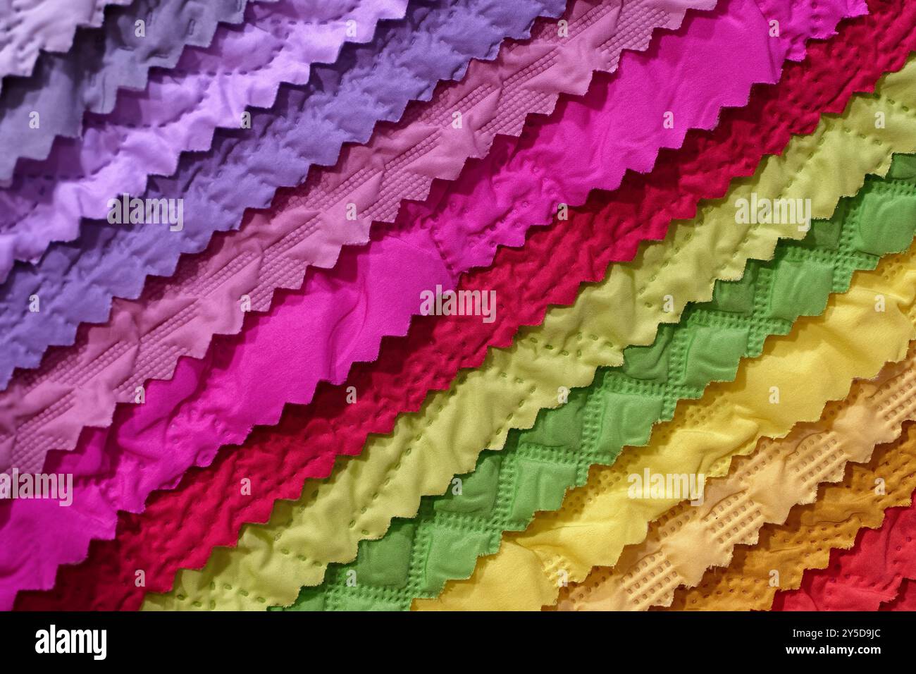 Samples of multi-coloured fabrics, abstract textile industry background Stock Photo