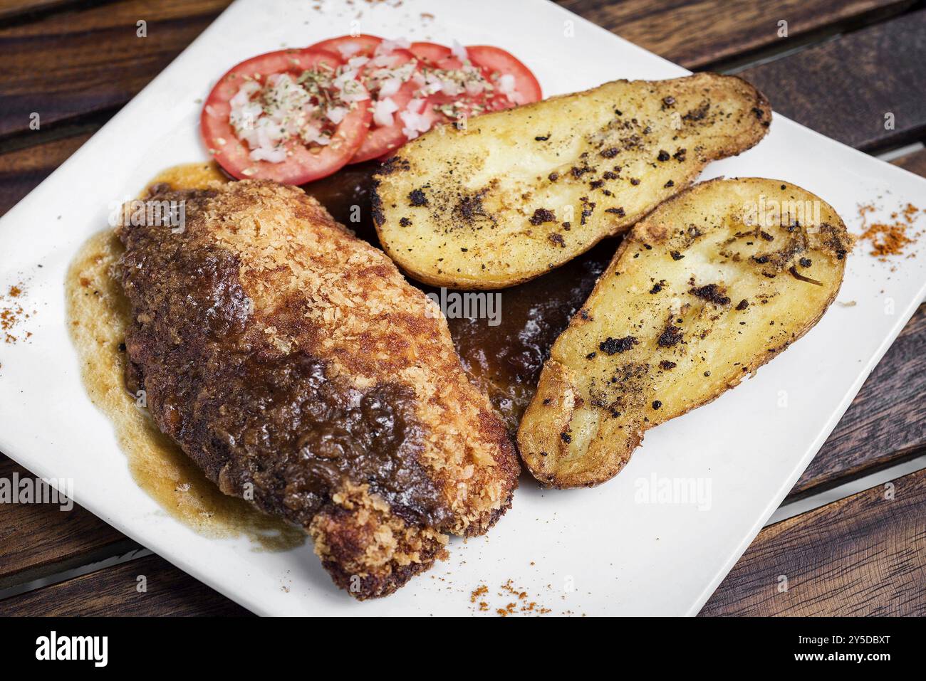 Chicken schnitzel with potato and gravy simple meal Stock Photo