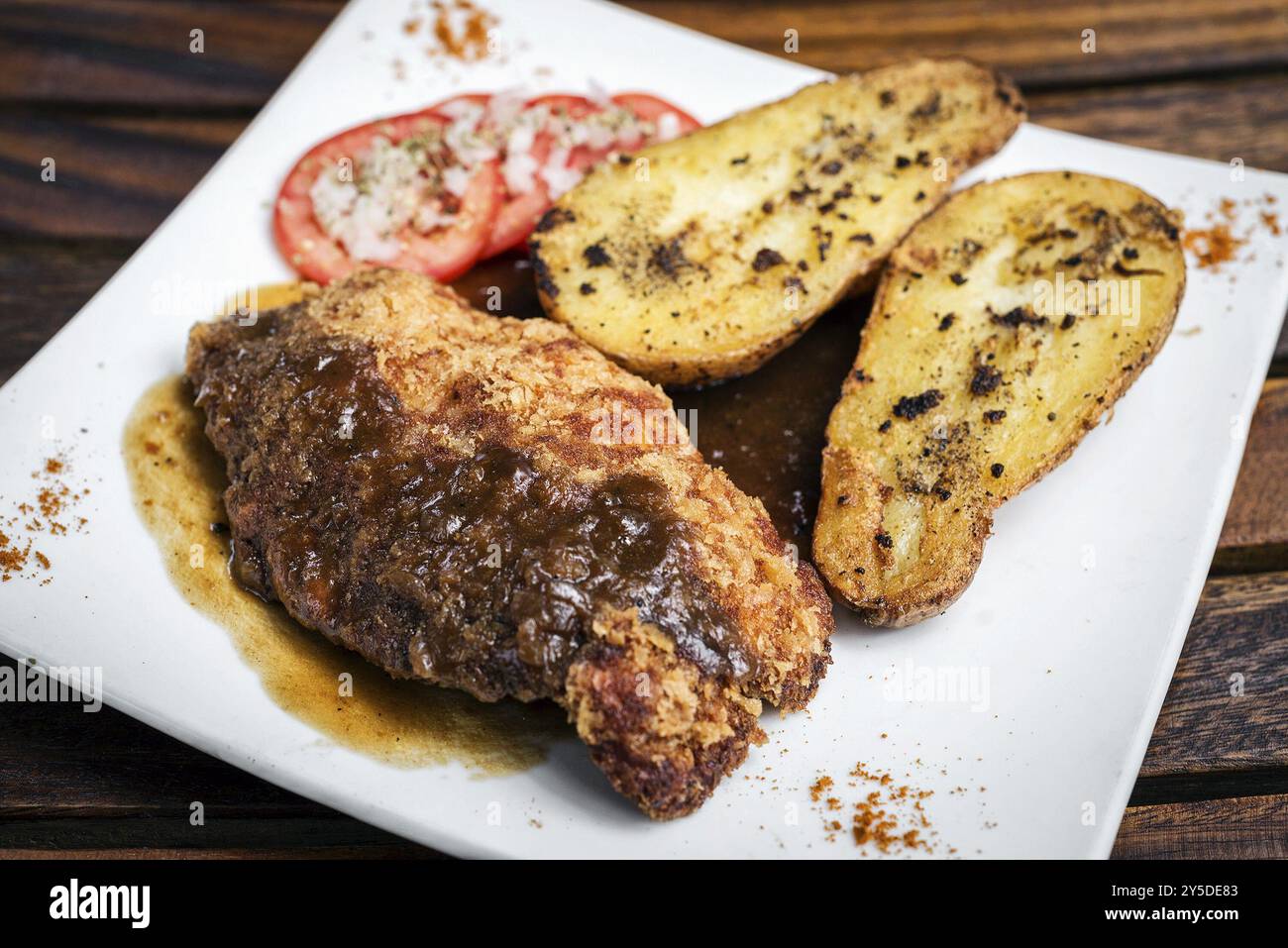 Chicken schnitzel with potato and gravy simple meal Stock Photo
