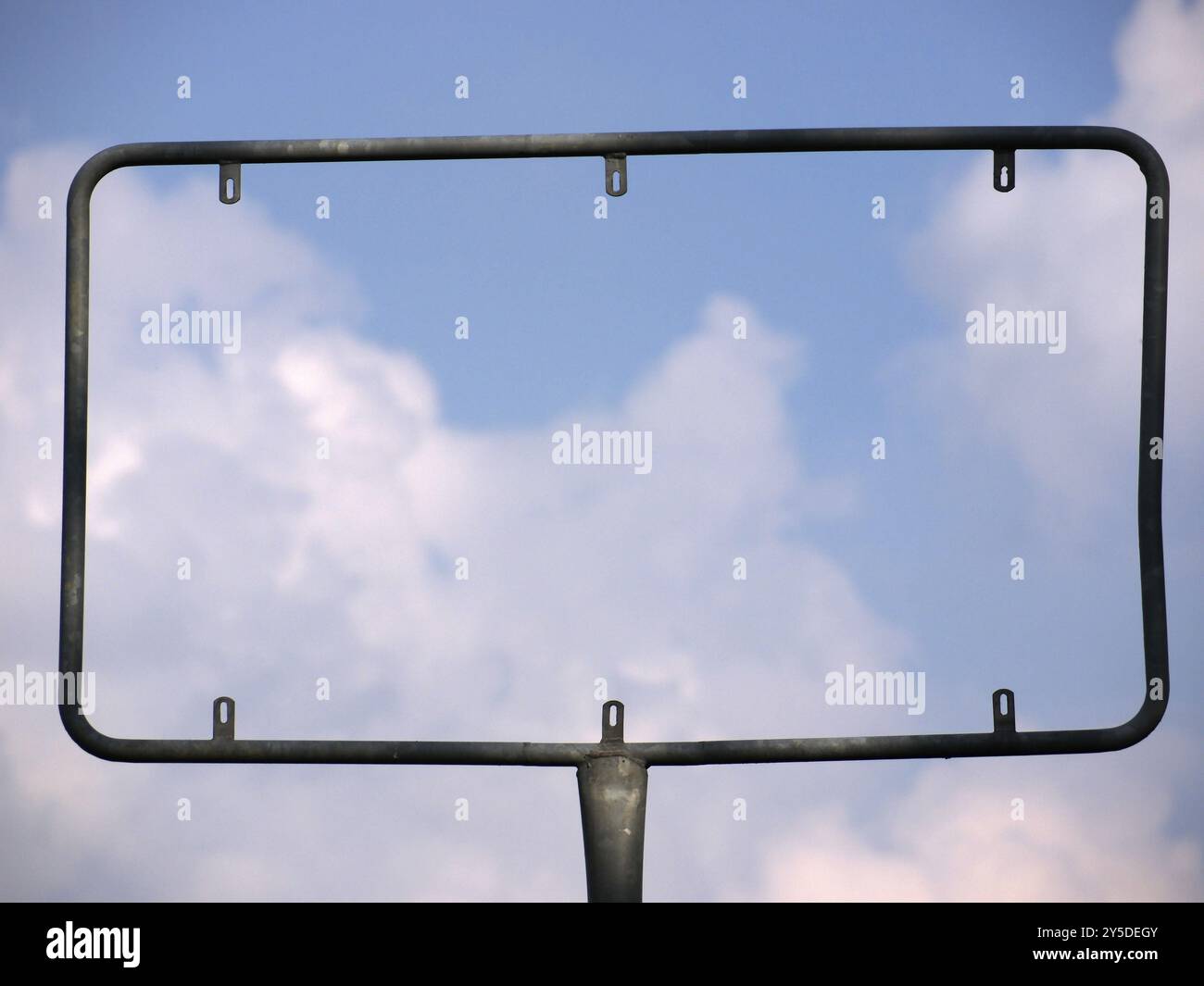 Empty advertising sign in front of a blue sky and clouds Stock Photo ...