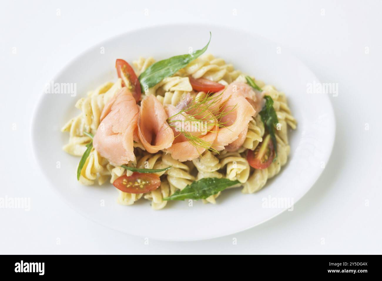 Smoked salmon tomato rocket and cream pasta Stock Photo - Alamy
