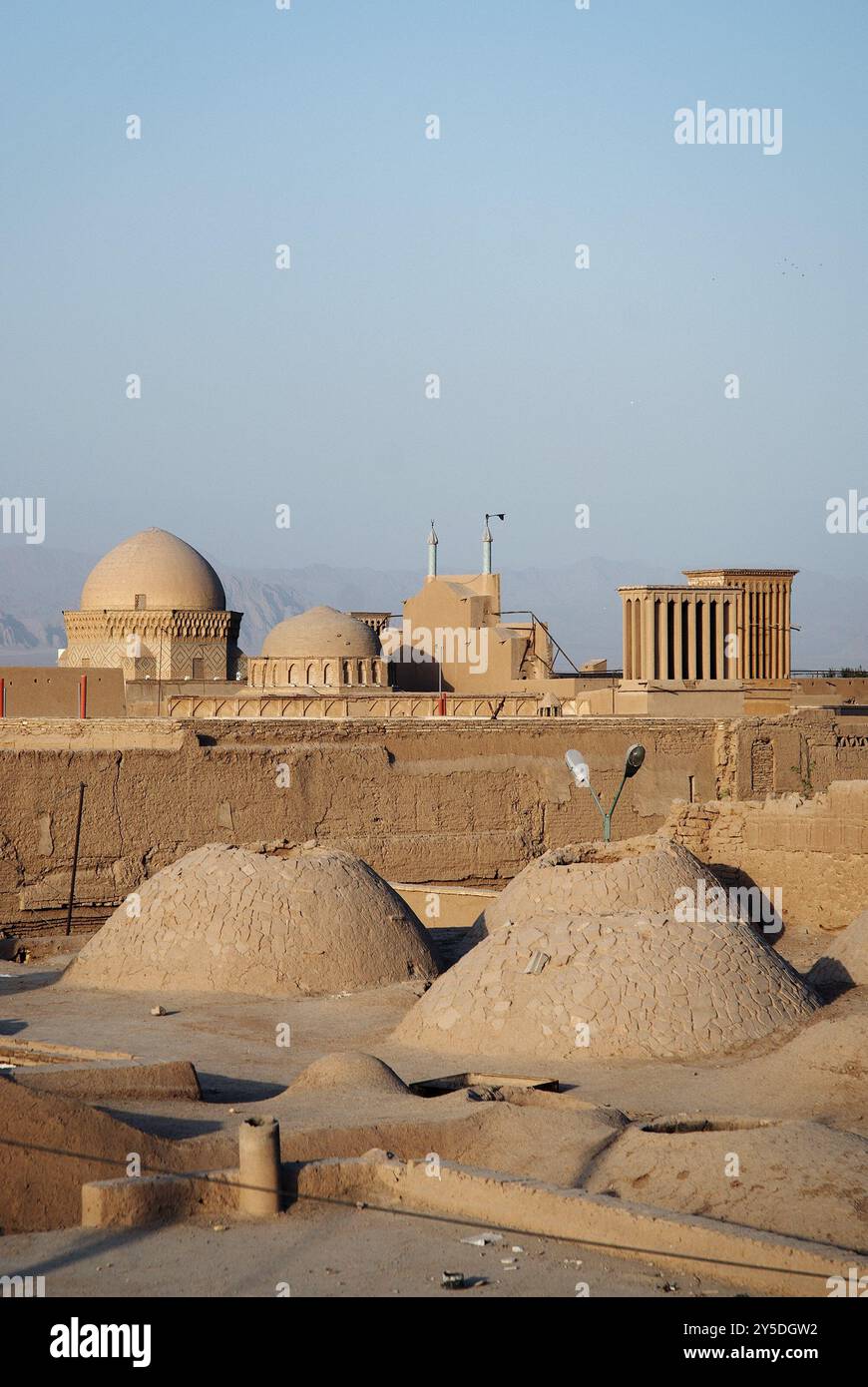 View of rooftops in yazd iran with desert mountains Stock Photo - Alamy