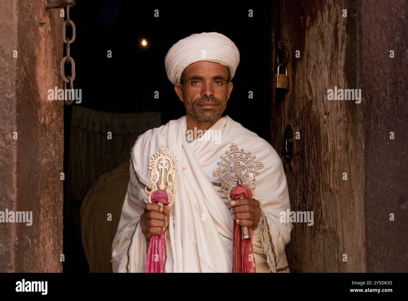 Priest with cross in lalibela ethiopia Stock Photo