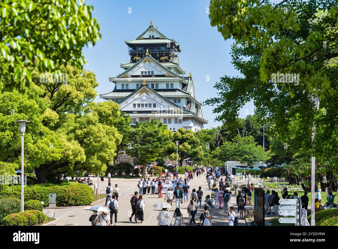 Osaka, Japan - 05.05.2024: Crowd of tourists visiting Osaka Castle, the most famous landmark and ...