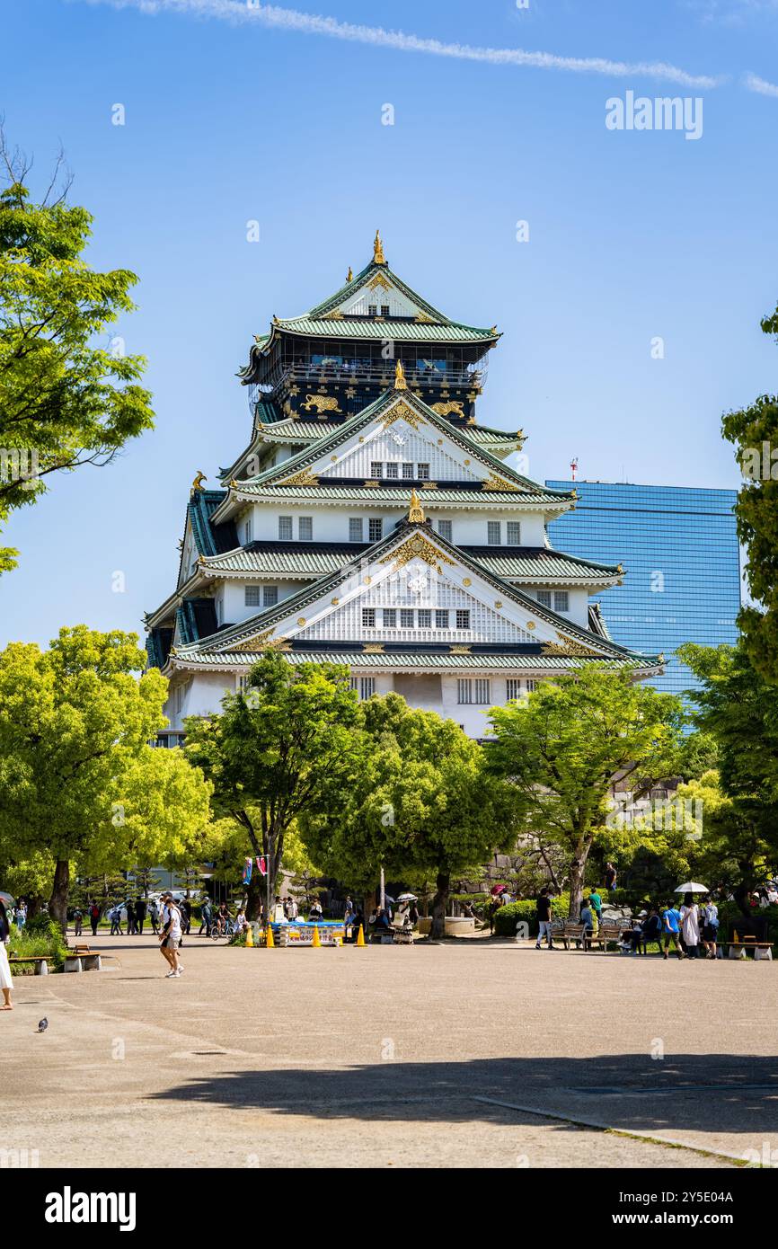 Osaka, Japan - 05.05.2024: Crowd of tourists visiting Osaka Castle, the most famous landmark and ...
