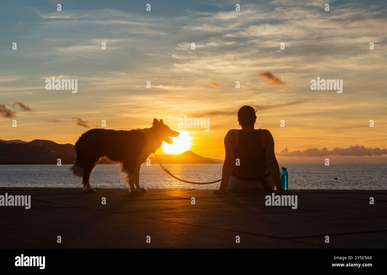 Gran Canaria, Canary Islands, Spain, 21st September 2024. People watch the sun set over the city beach in Las Palmas on Gran Canaria. Credit: Alan Dawson/Alamy Live News. Stock Photo