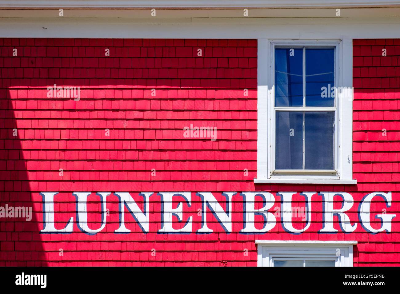 Lunenburg sign written with white lettering on a colourful red wooden ...