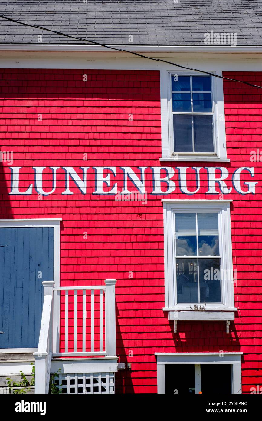 Lunenburg sign written with white lettering on a colourful red wooden ...