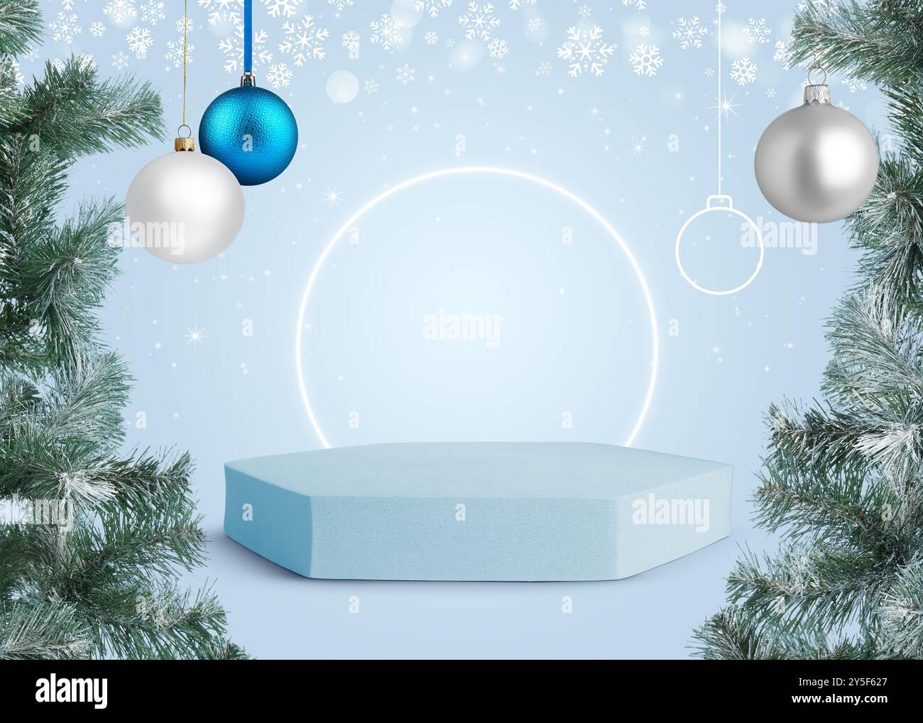 Christmas balls and snowflakes over empty podium on light blue ...