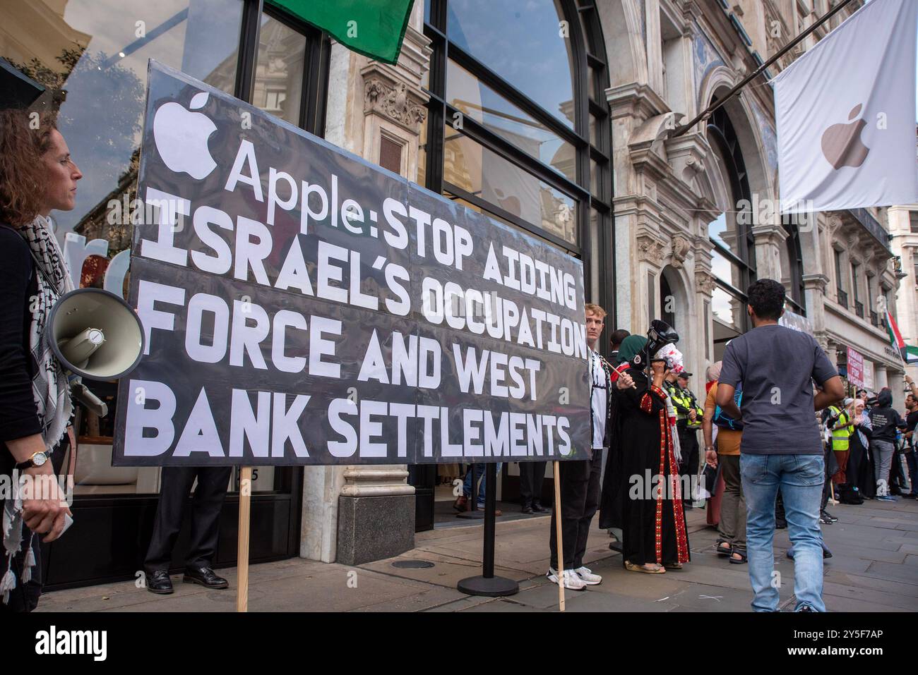 London, England, UK. 22nd Sep, 2024. Congolese, Palestinian and Uyghur demonstrators gathered by the Apple Store on the Regent Street in London. Protesters demand from the Apple to cut the ties with China because of the Uyghurs work as forced labour to make iPhones at the work camps. Also, demand from the Apple to stop aiding Israel because of the war and stop child labour and exploitation at the cobalt mines in Democratic Republic of Congo. (Credit Image: © Krisztian Elek/ZUMA Press Wire) EDITORIAL USAGE ONLY! Not for Commercial USAGE! Stock Photo