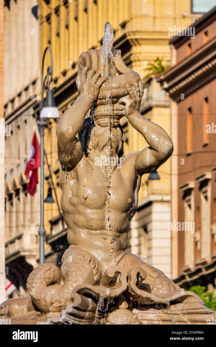 A close-up of the Fontana del Tritone in Rome, depicting the sea god Triton blowing a conch shell, located in Piazza Barberini. Stock Photo