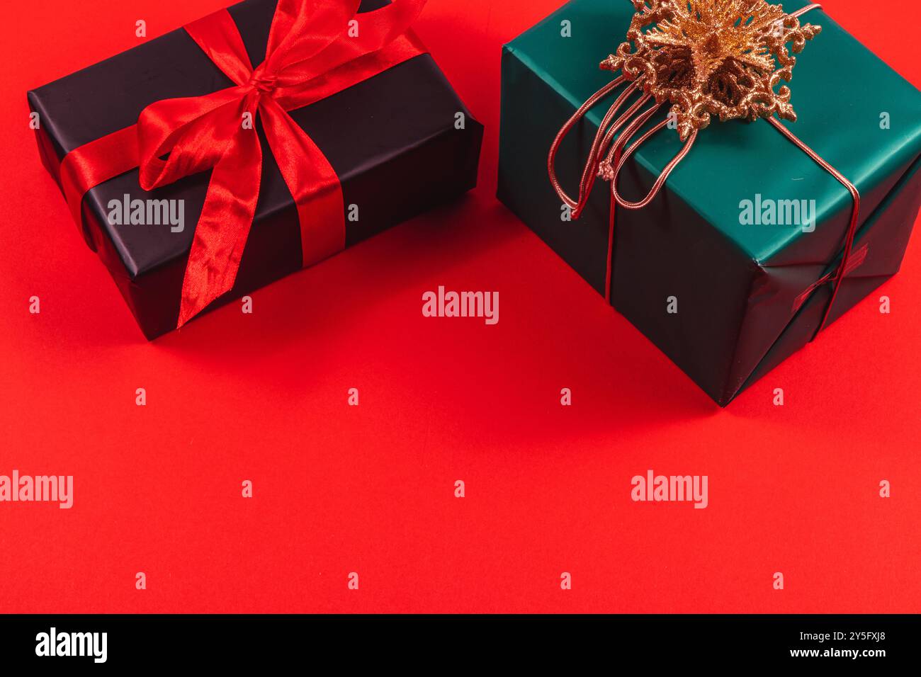 Black and green gift boxes with bows on a red background Stock Photo ...
