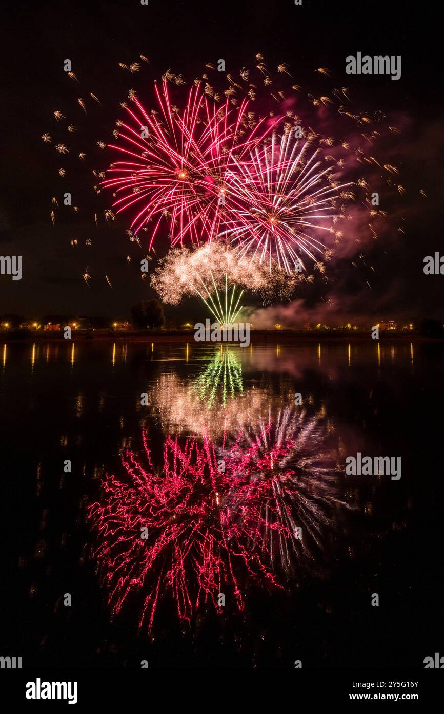 Colourful fireworks, part of the Dresdner Schlössernacht event, are reflected in the water of the river Elbe. Stock Photo