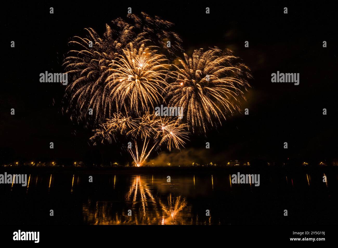 Colourful fireworks, part of the Dresdner Schlössernacht event, are reflected in the water of the river Elbe. Stock Photo
