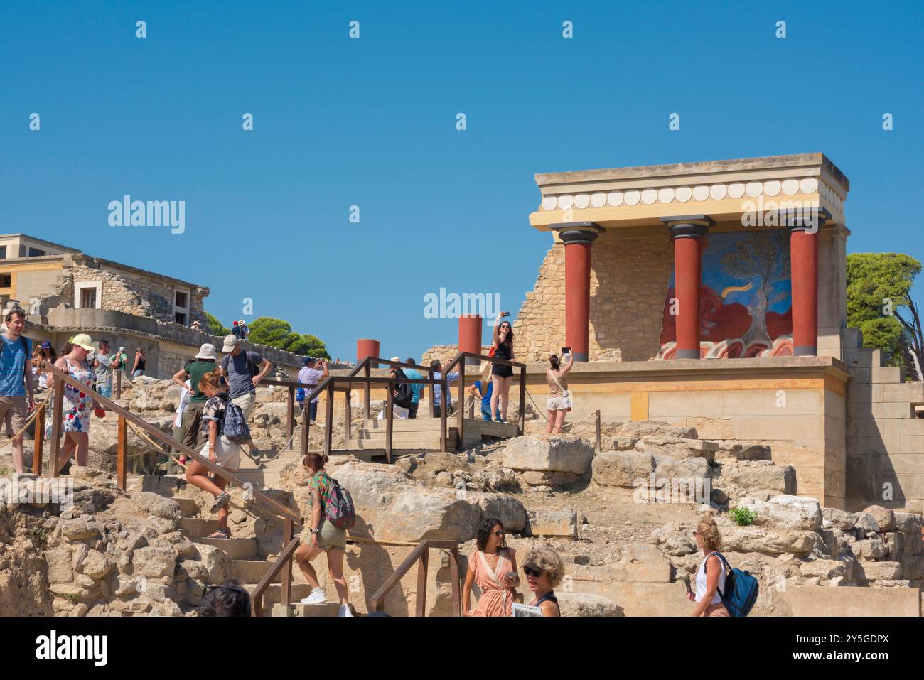 Knossos Palace Crete, view in summer of tourists visiting the ancient Minoan ruins of Knossos Palace dating from 1700 BC, Heraklion, Crete, Greece Stock Photo