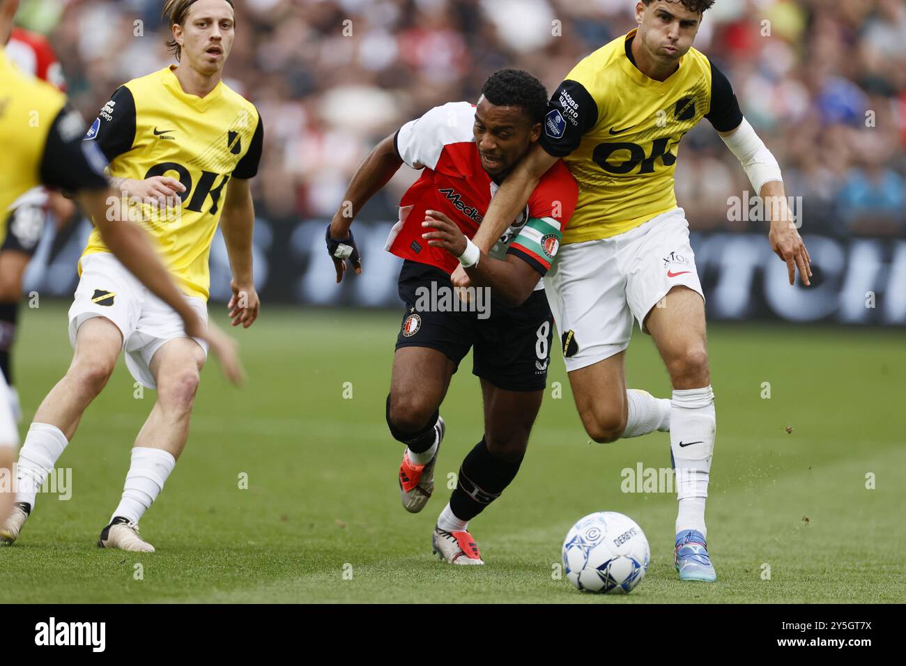 ROTTERDAM - (l-r) Quinten Timber of Feyenoord. Matthew Garbett of NAC Breda during the Dutch Eredivisie match between Feyenoord and NAC Breda at Feyenoord Stadion de Kuip on Sept. 22, 2024 in Rotterdam, Netherlands. ANP PIETER STAM DE JONGE Stock Photo