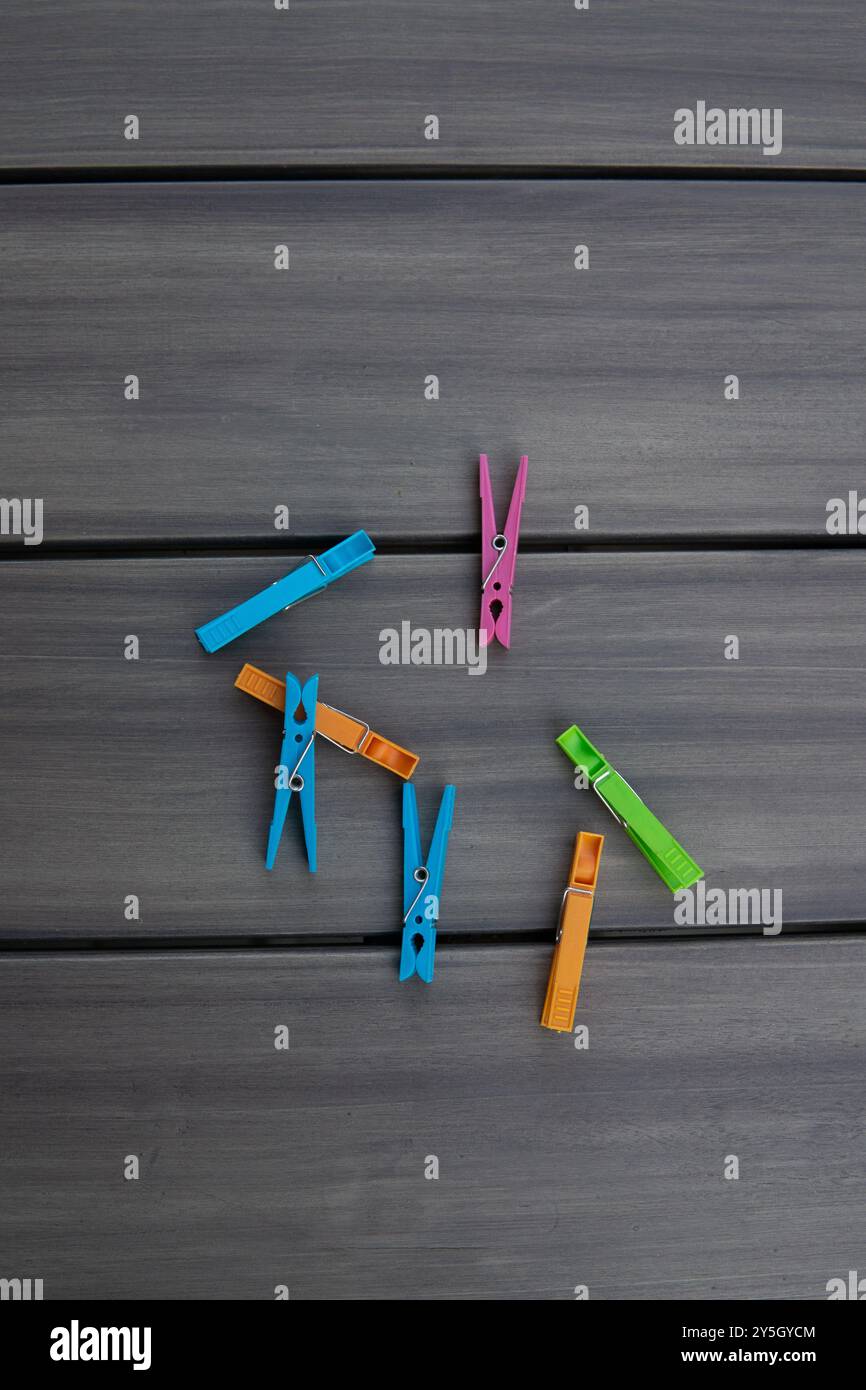 clothespins on a wooden table Stock Photo