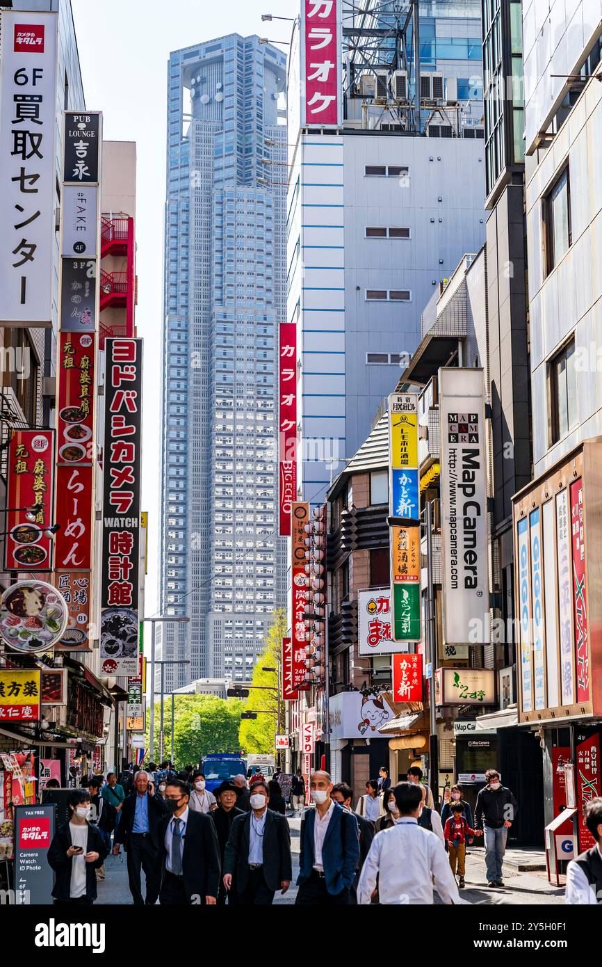 View along Chuo dori, a narrow shopping street in Shinjuku with the ...