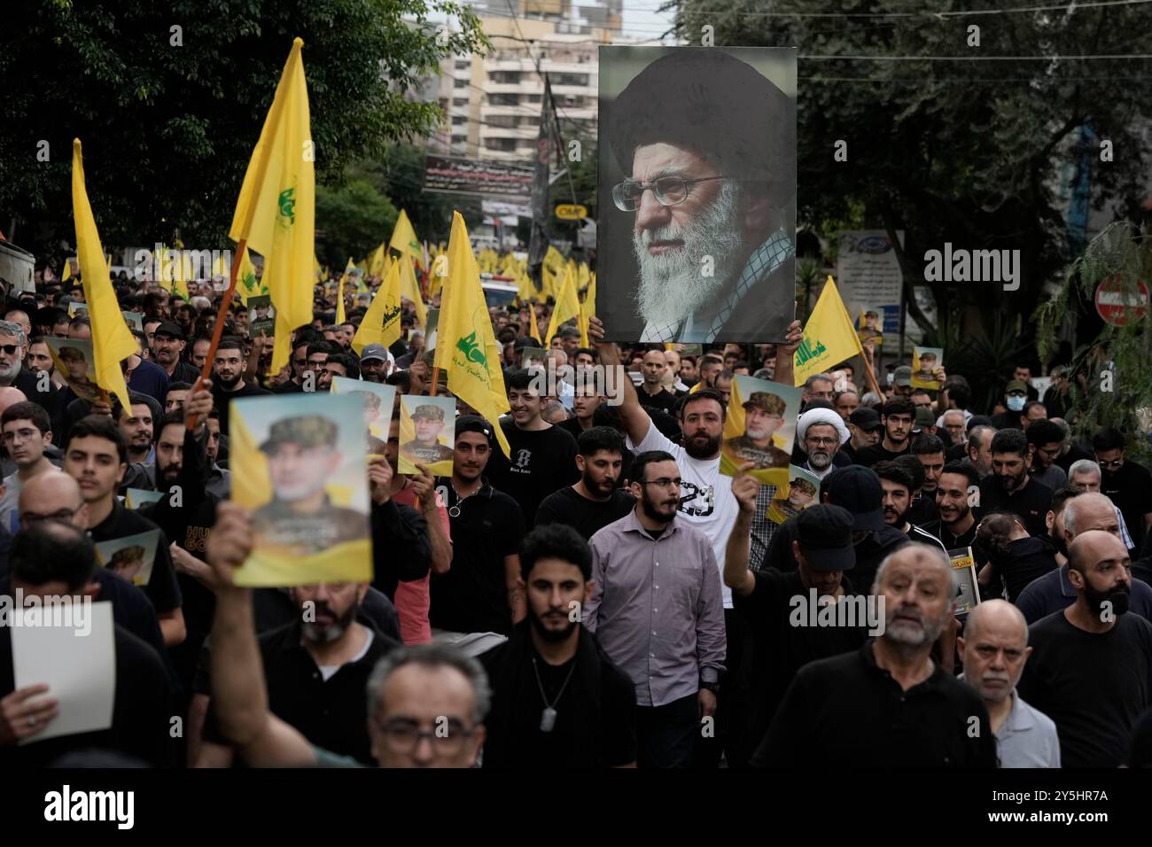 Hezbollah supporters carry pictures of Hezbollah commander Ibrahim Akil ...