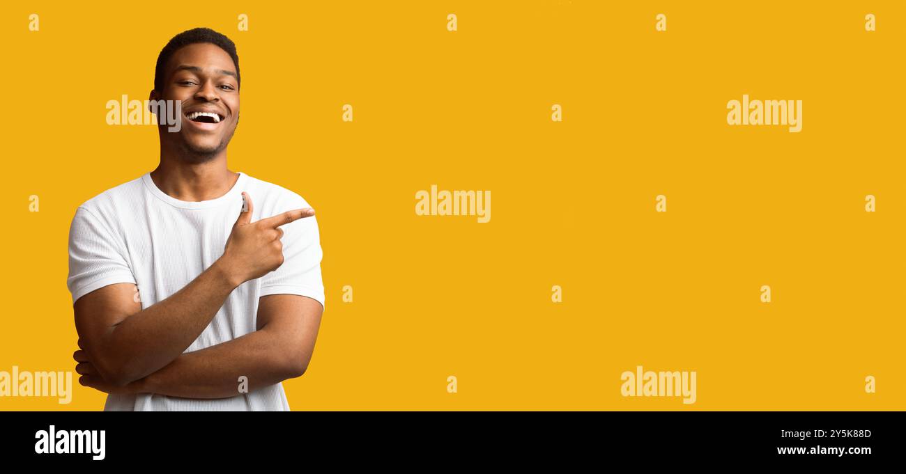 African american man pointing aside at empty space Stock Photo