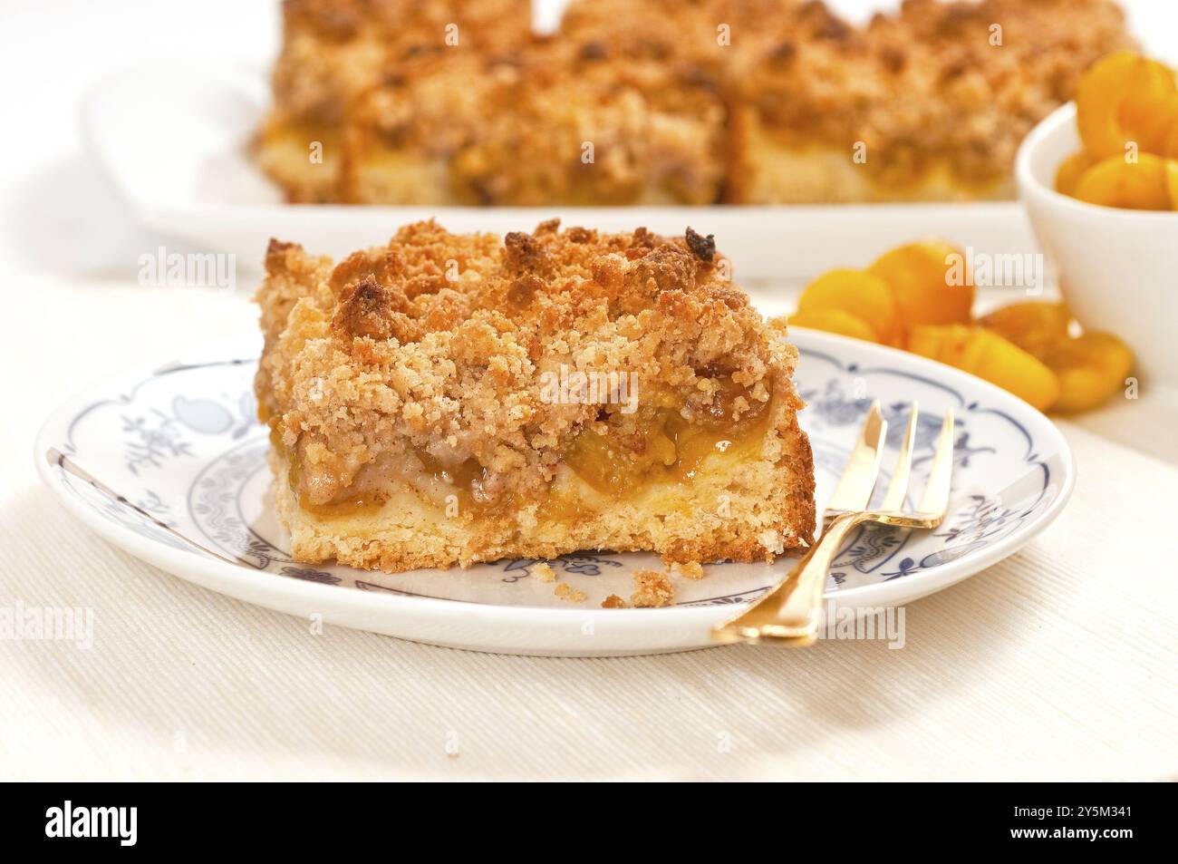 Mirabelle plum crumble cake on a white background Stock Photo - Alamy
