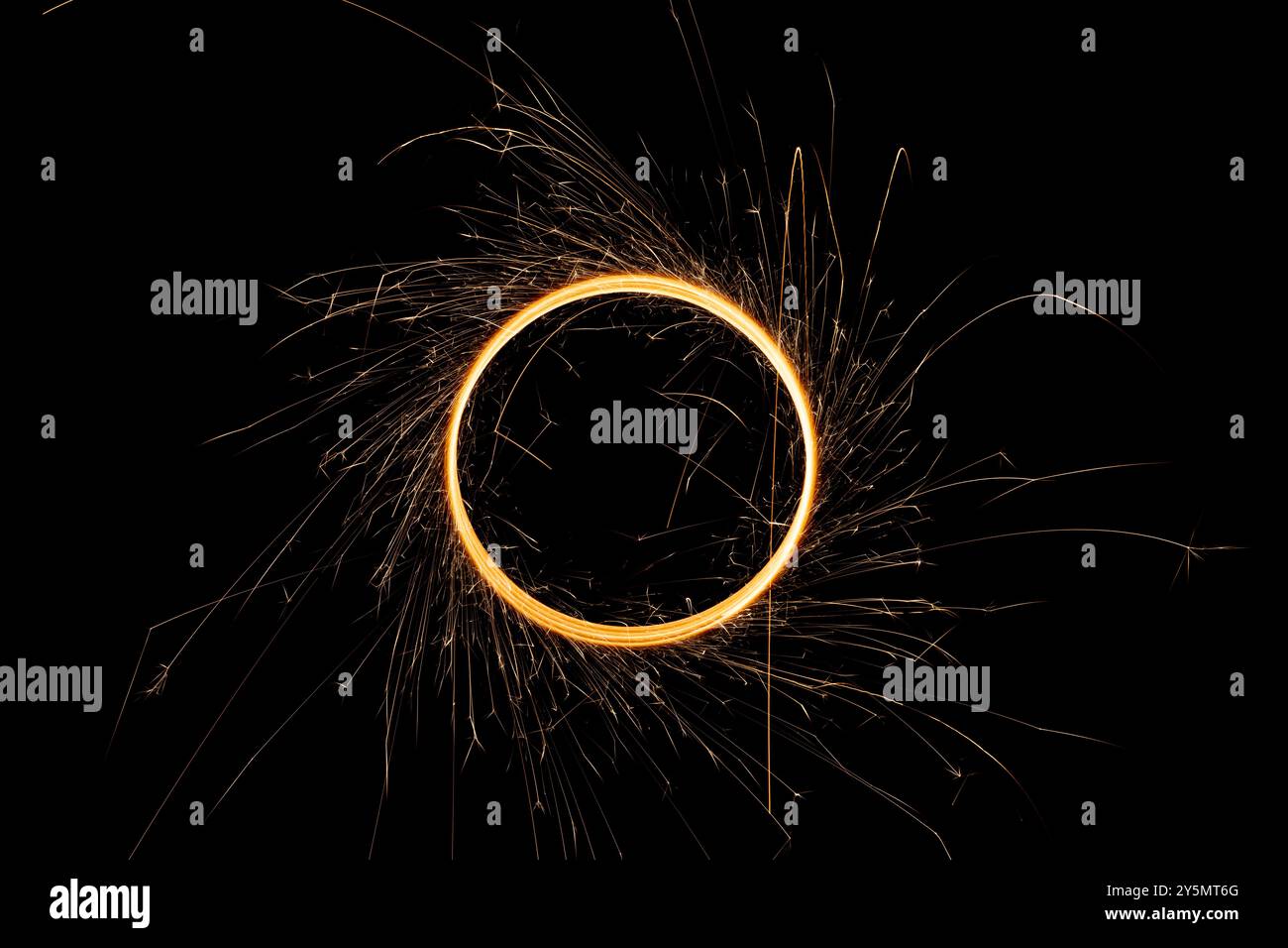 Circular lights with sparks on a black background Stock Photo