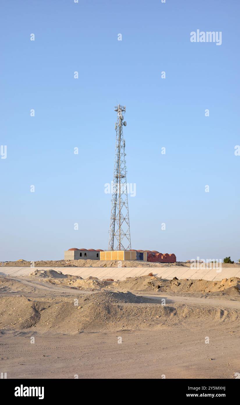 A photo of a telecommunications tower against a blue sky. Stock Photo