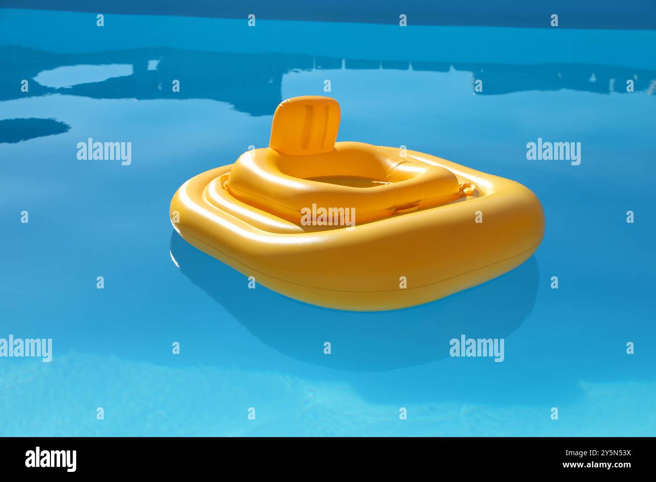Yellow float in swimming pool at luxury resort Stock Photo - Alamy