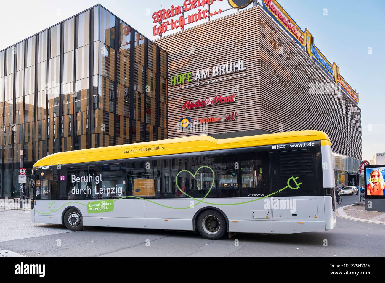 eBus in front of the Hoefe am Bruehl shopping centre in Leipzig Stock Photo