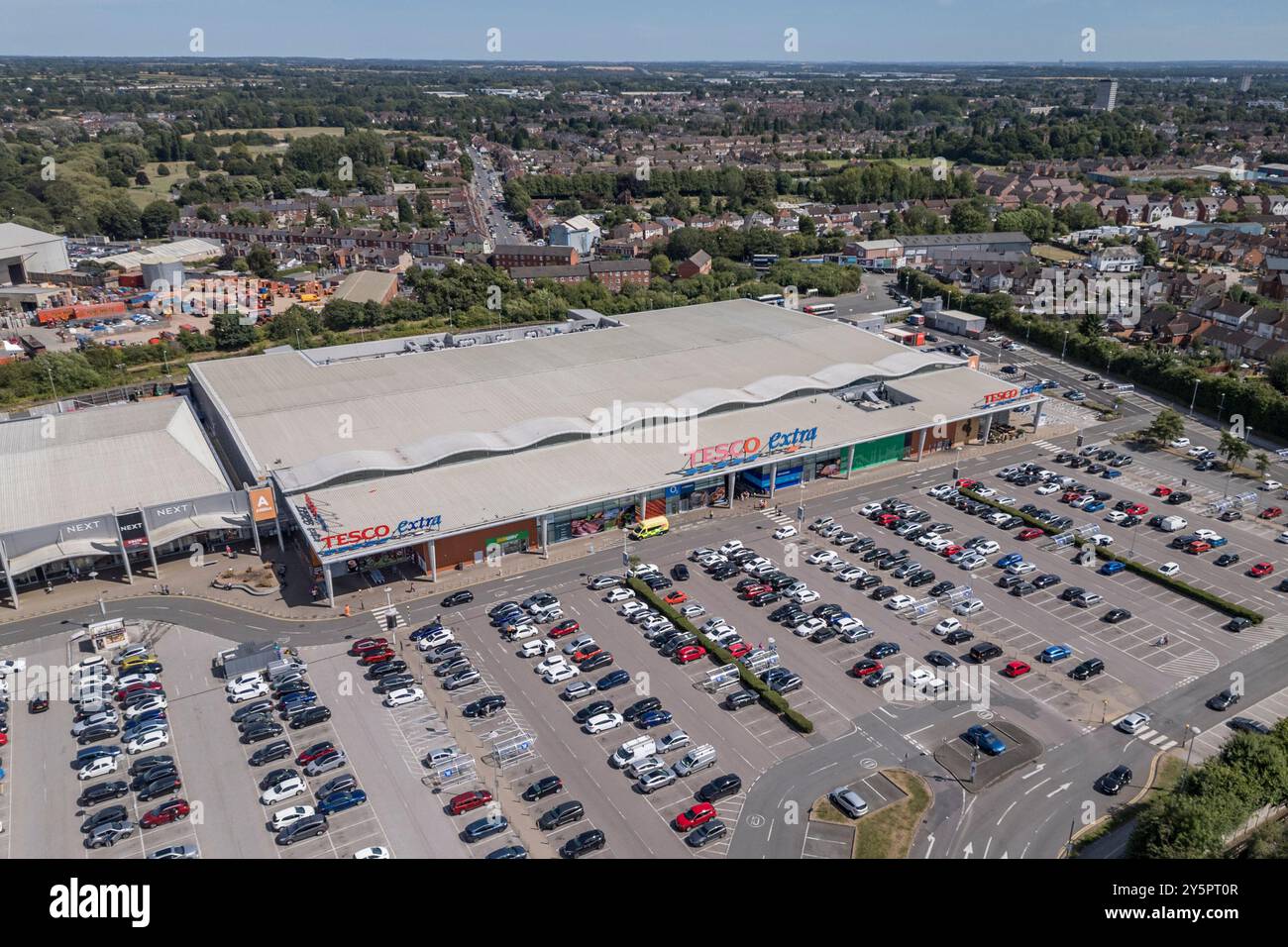 Aerial view of the Tesco Extra supermarket and car park at Arena Shopping Park, Coventry, UK. Stock Photo