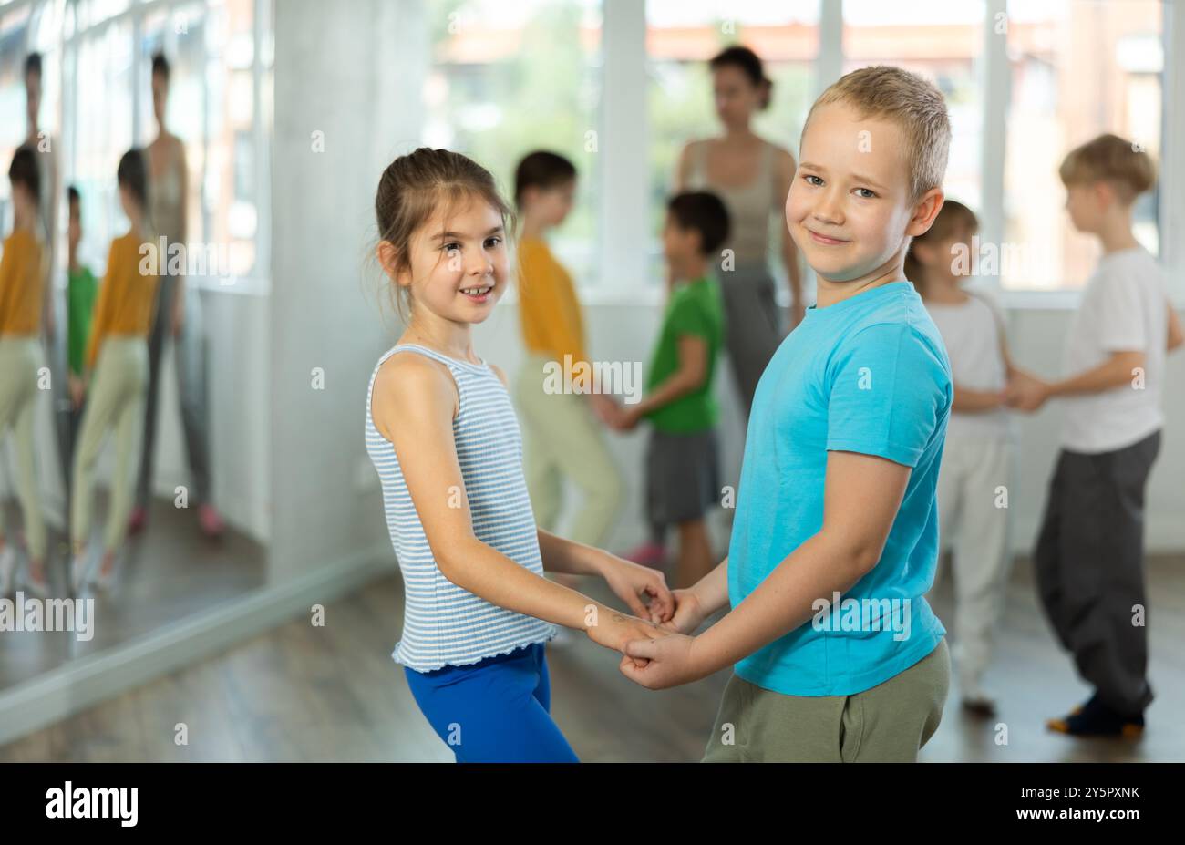 Girl paired up with boy and training to perform slow couple dance ...