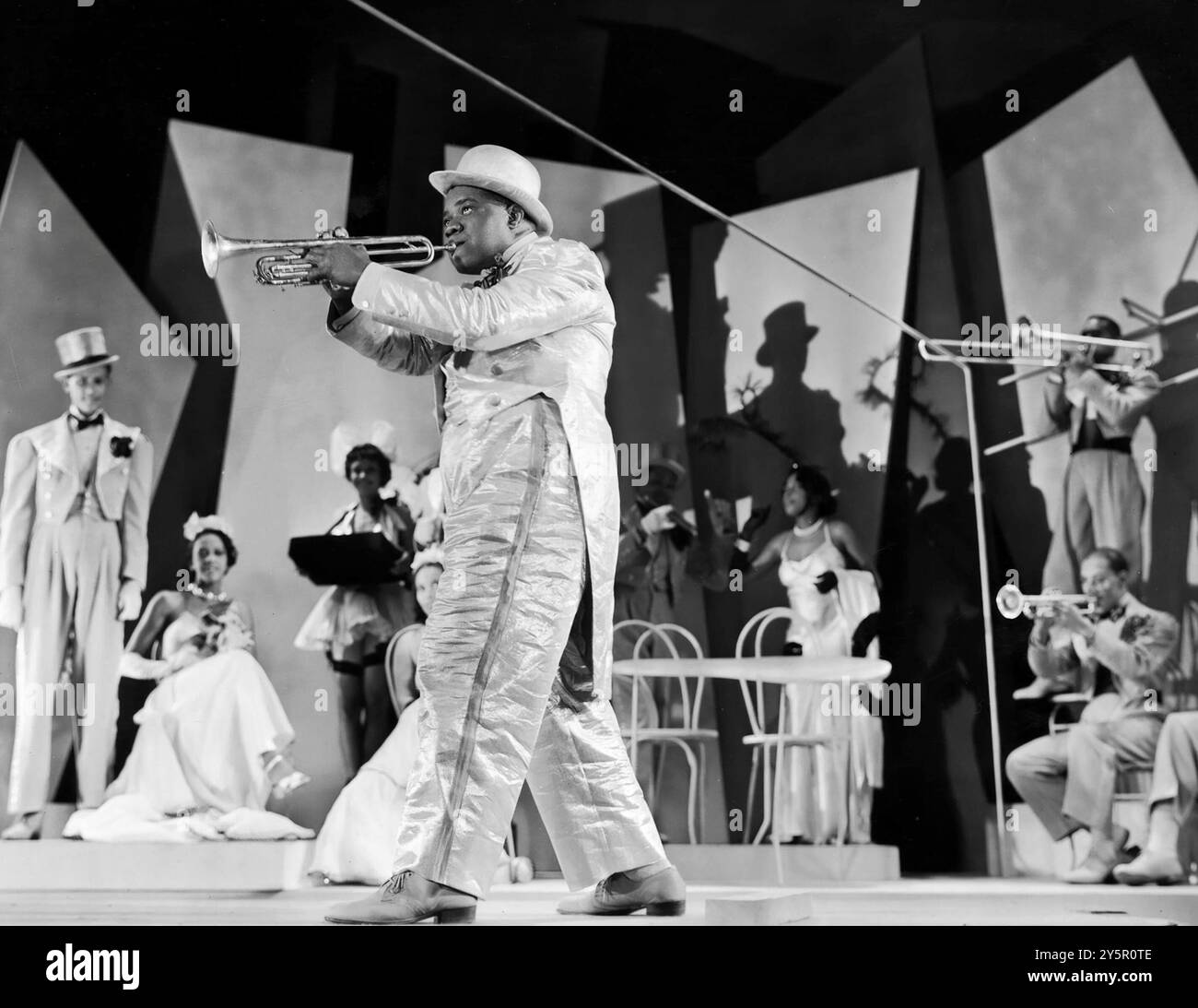 Jazz legend Louis Armstrong playing trumpet in "Doctor Rhythm" publicity photo 1938 Stock Photo