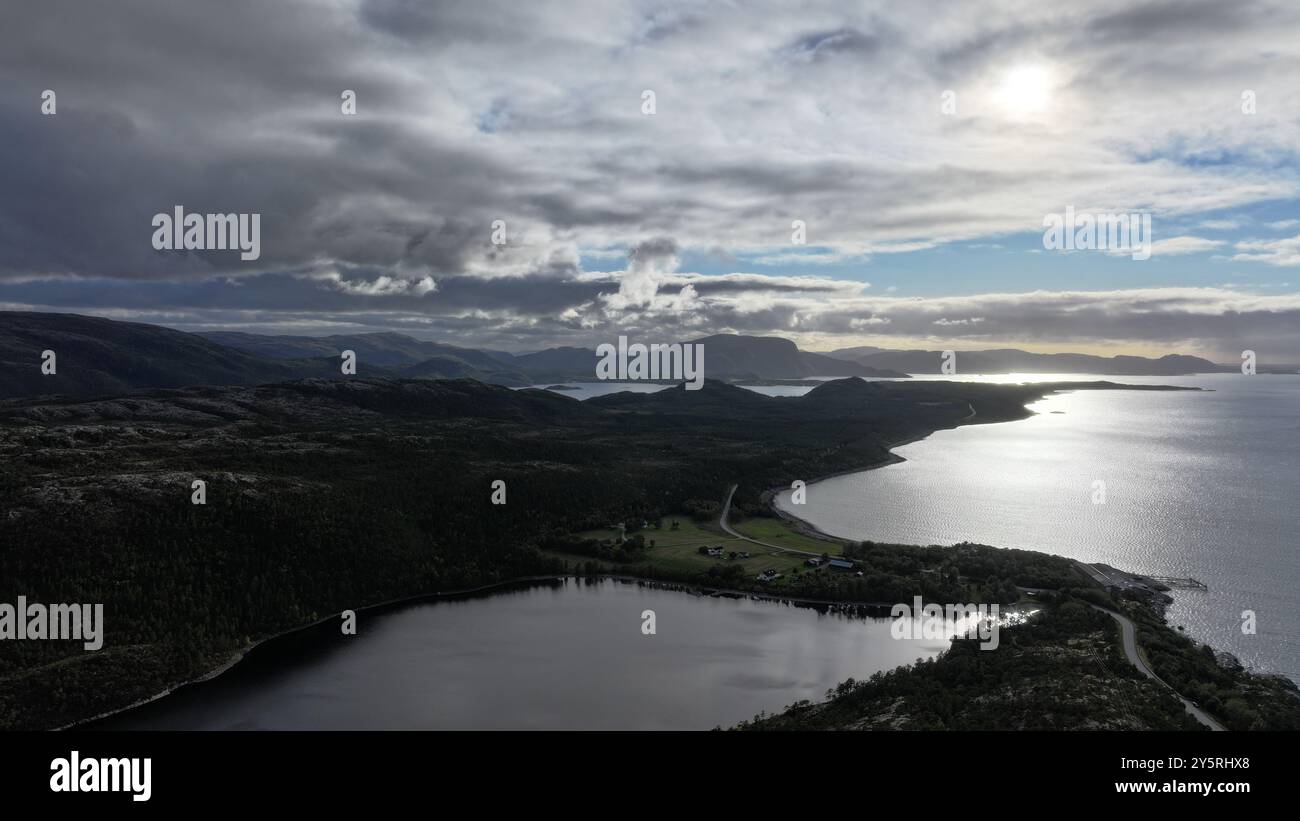 A stunning aerial view of a coastal landscape with mountains, a winding ...