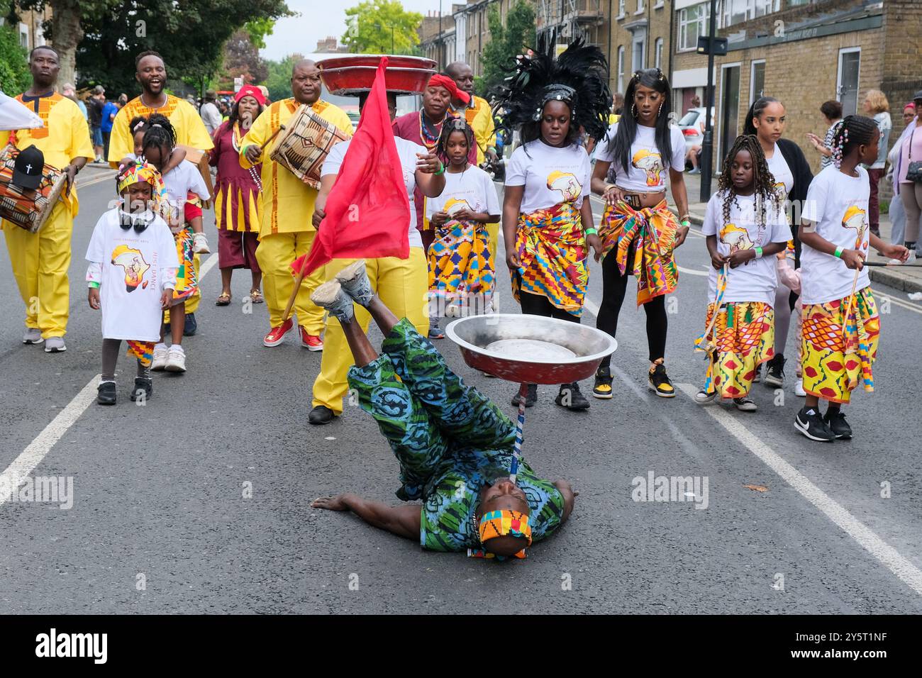 Gahu Dramatic Arts group take part in the Hackney Carnival Parade, with acrobatics and fire breathing. Stock Photo