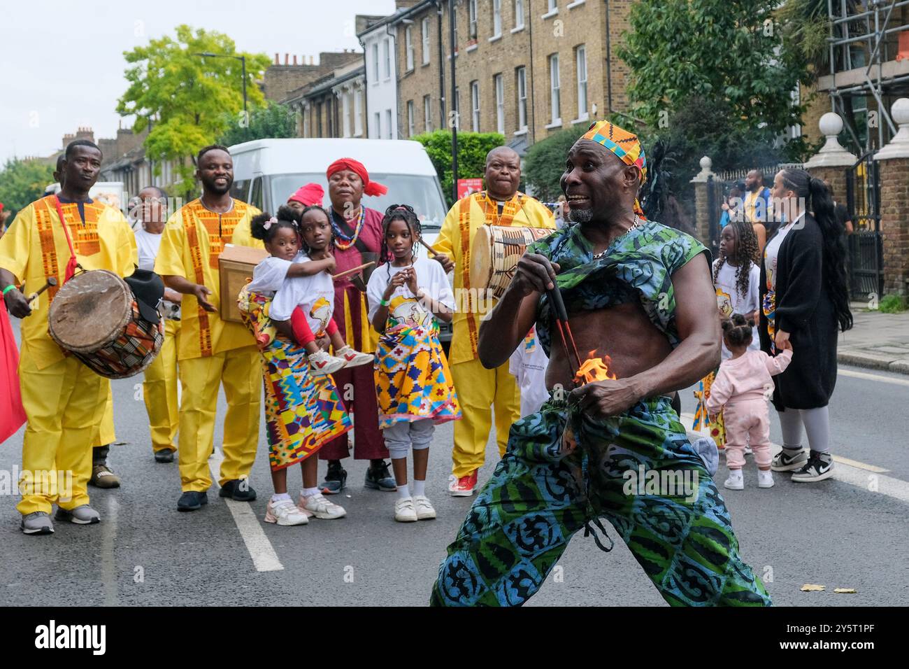 Gahu Dramatic Arts group take part in the Hackney Carnival Parade, with acrobatics and fire breathing. Stock Photo