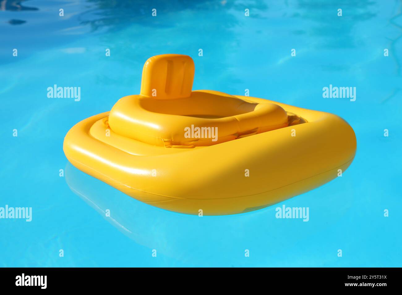 Yellow float in swimming pool at luxury resort Stock Photo - Alamy
