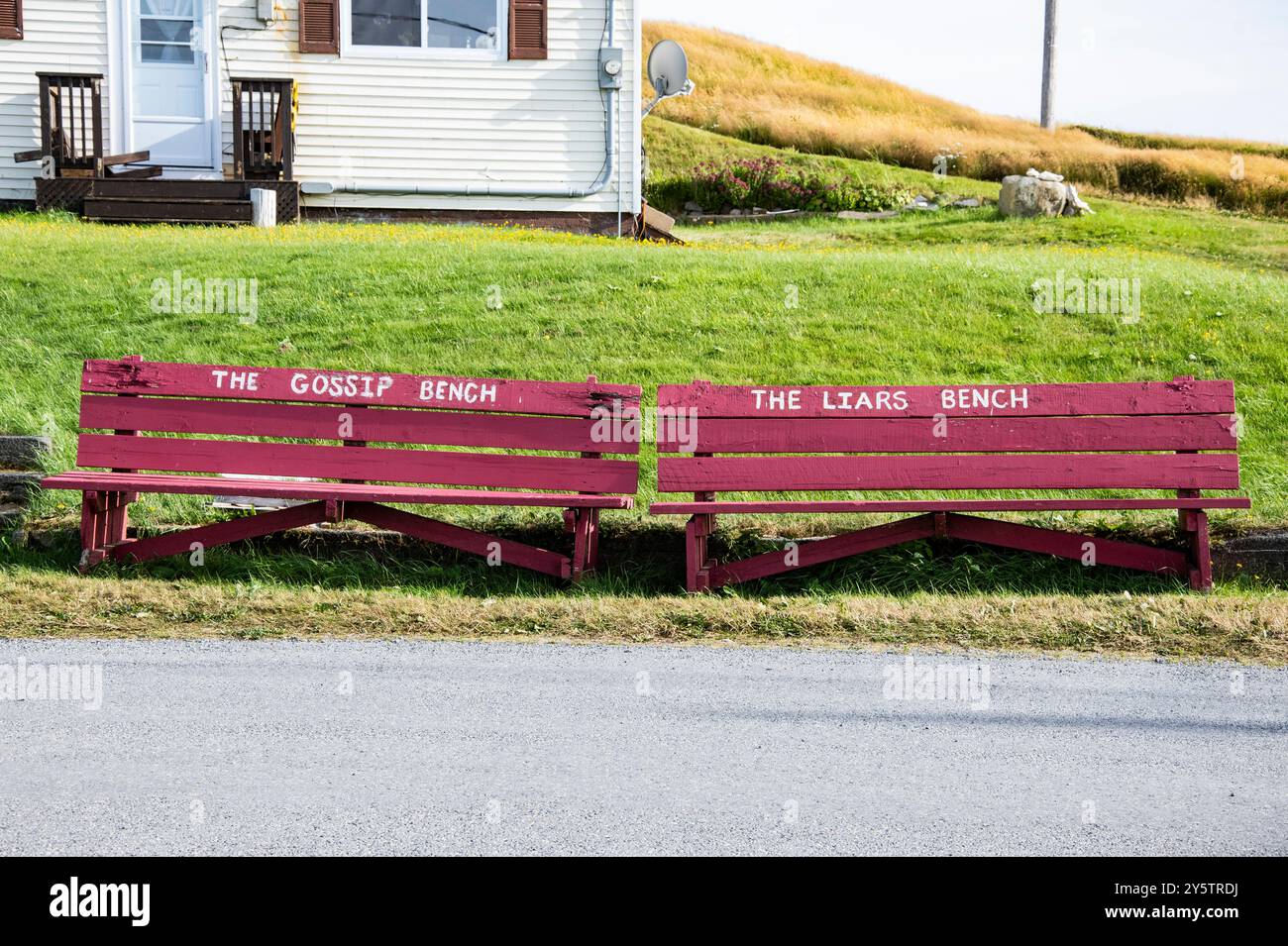 The gossip bench and liars bench on The Down's in Ferryland, Newfoundland & Labrador, Canada Stock Photo