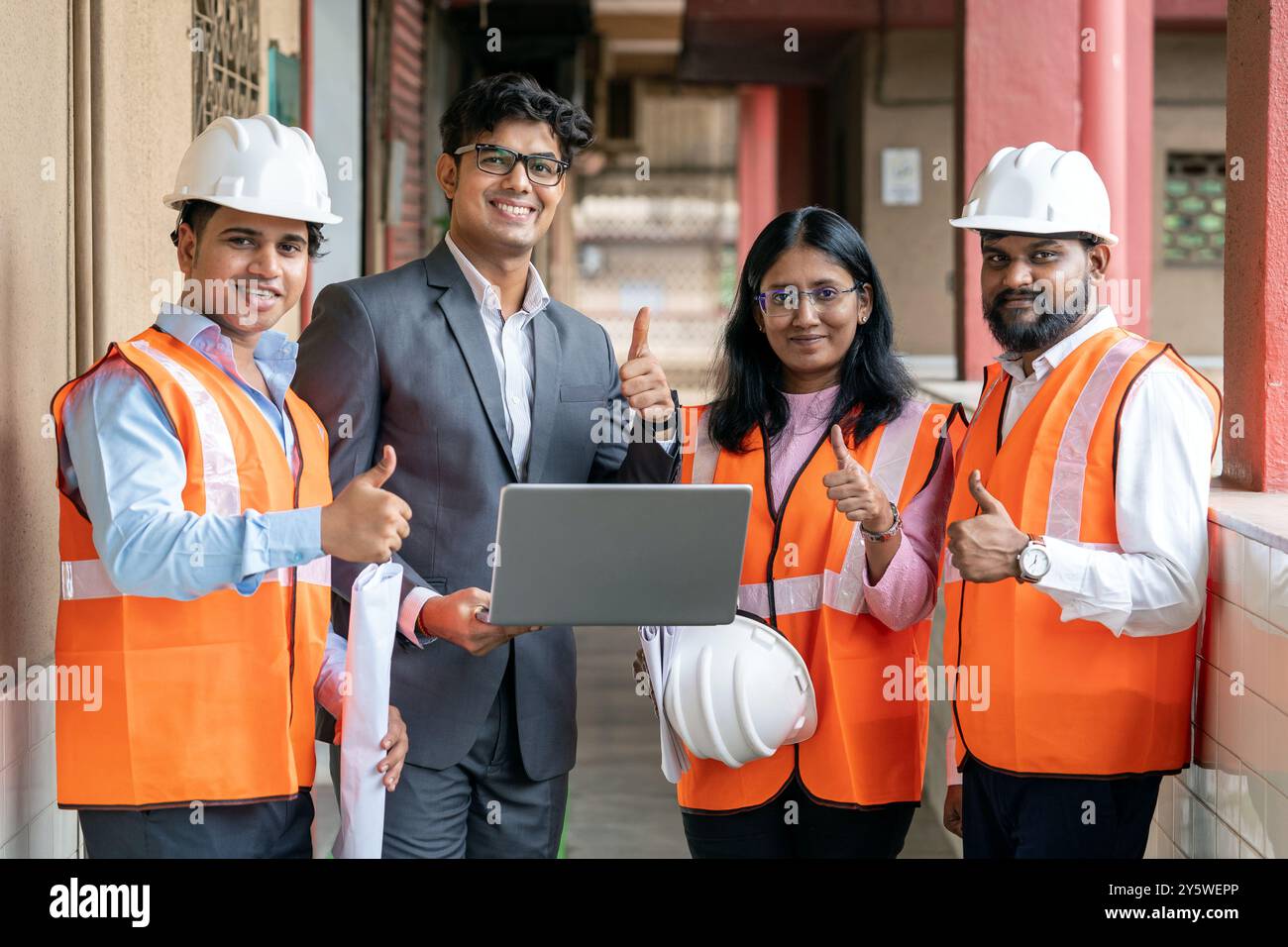 A skilled team of engineers is engaged in maintenance and training activities within a factory workshop The team’s expertise in mechanical engineering Stock Photo