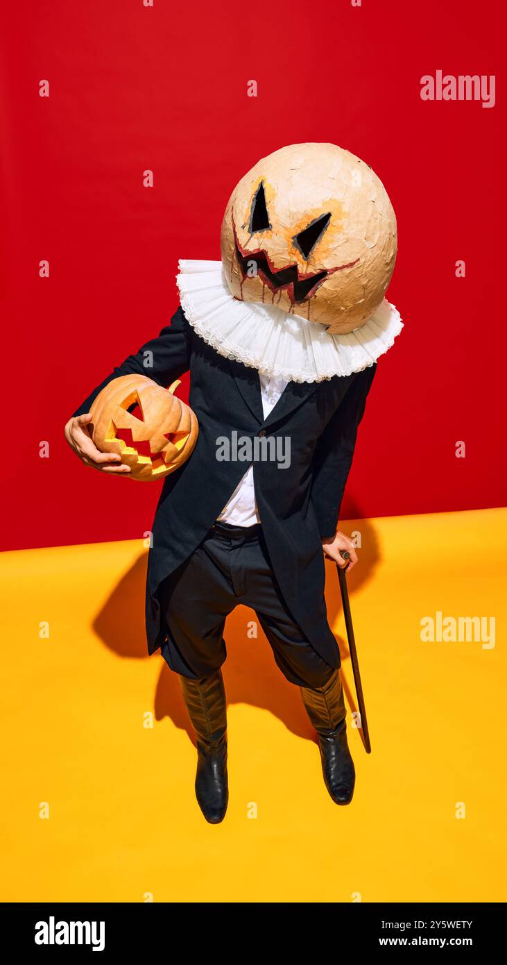 Creepy character in Victorian style suit with ruff and terrifying mask ...