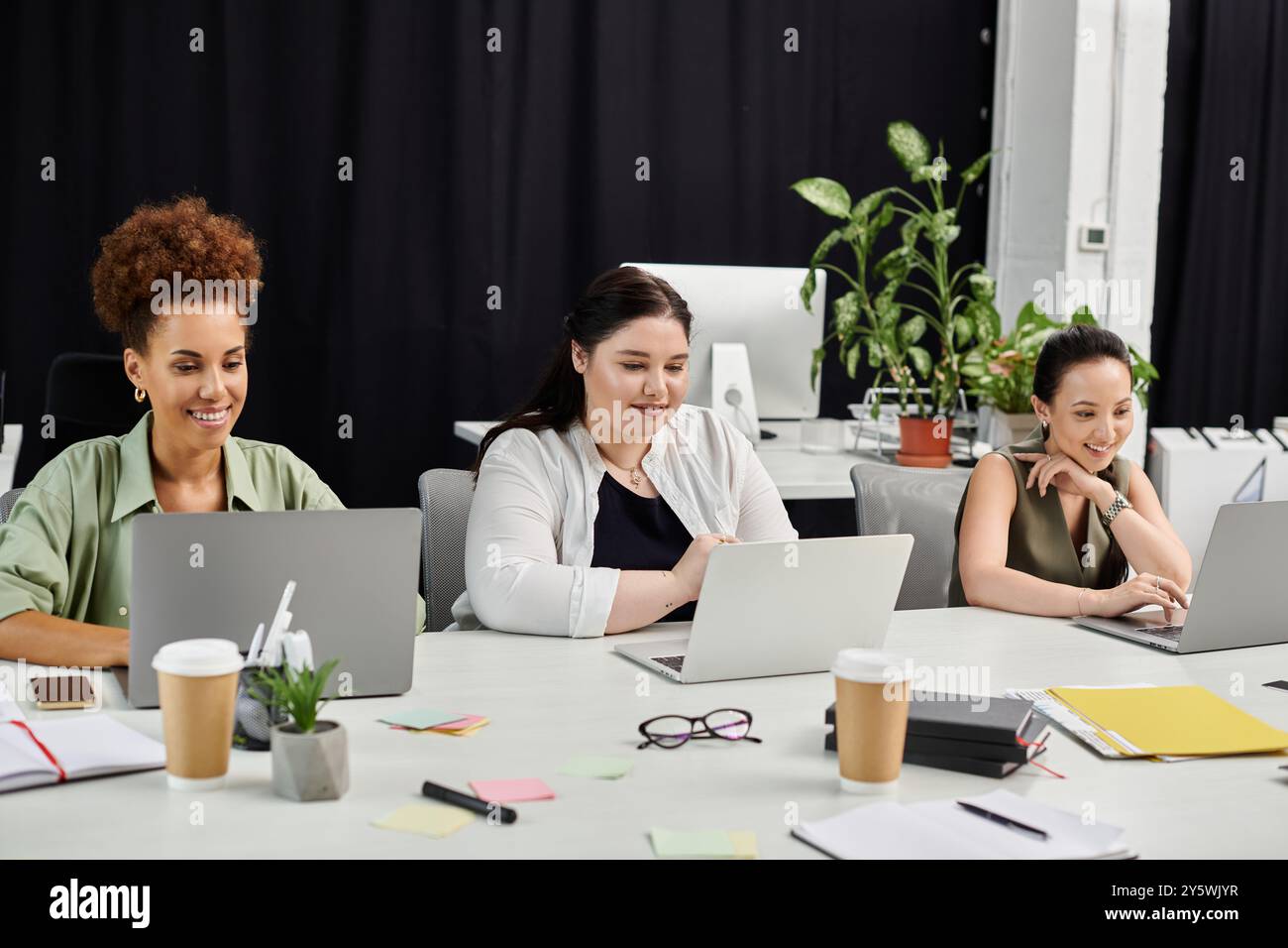 Three women engage in dynamic hi-res stock photography and images - Alamy