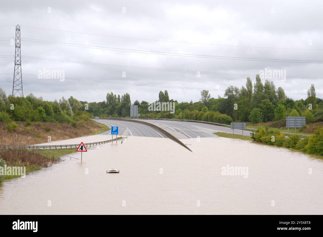 the-open-boot-of-a-car-is-visible-above-the-water-where-the-vehicle-is