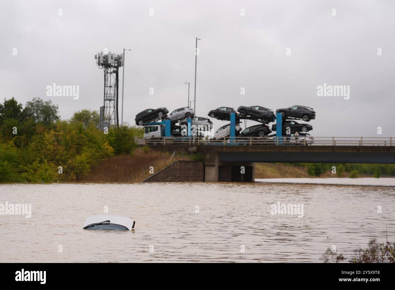 the-open-boot-of-a-car-is-visible-above-the-water-where-the-vehicle-is