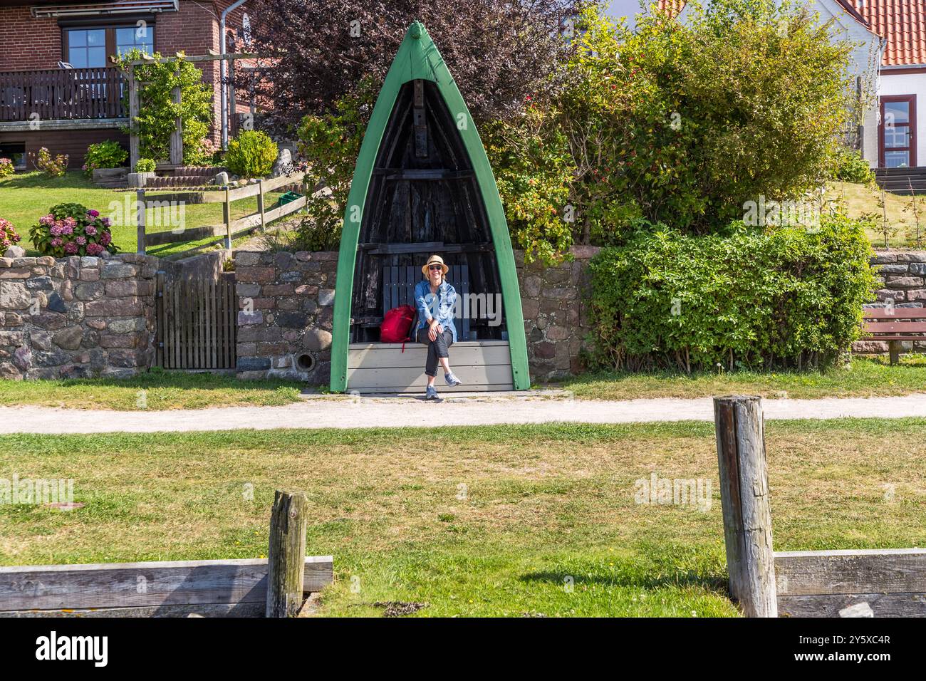 Waterfront promenade in Maasholm with jetty and benches in the shape of a ship's bow. Maasholm, Am Kliff, Geltinger Bucht, Schleswig-Holstein, Germany Stock Photo