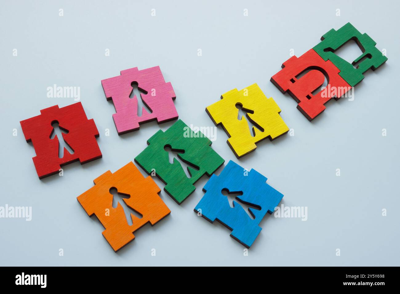 Puzzle pieces with a magnet attracting customers. Stock Photo
