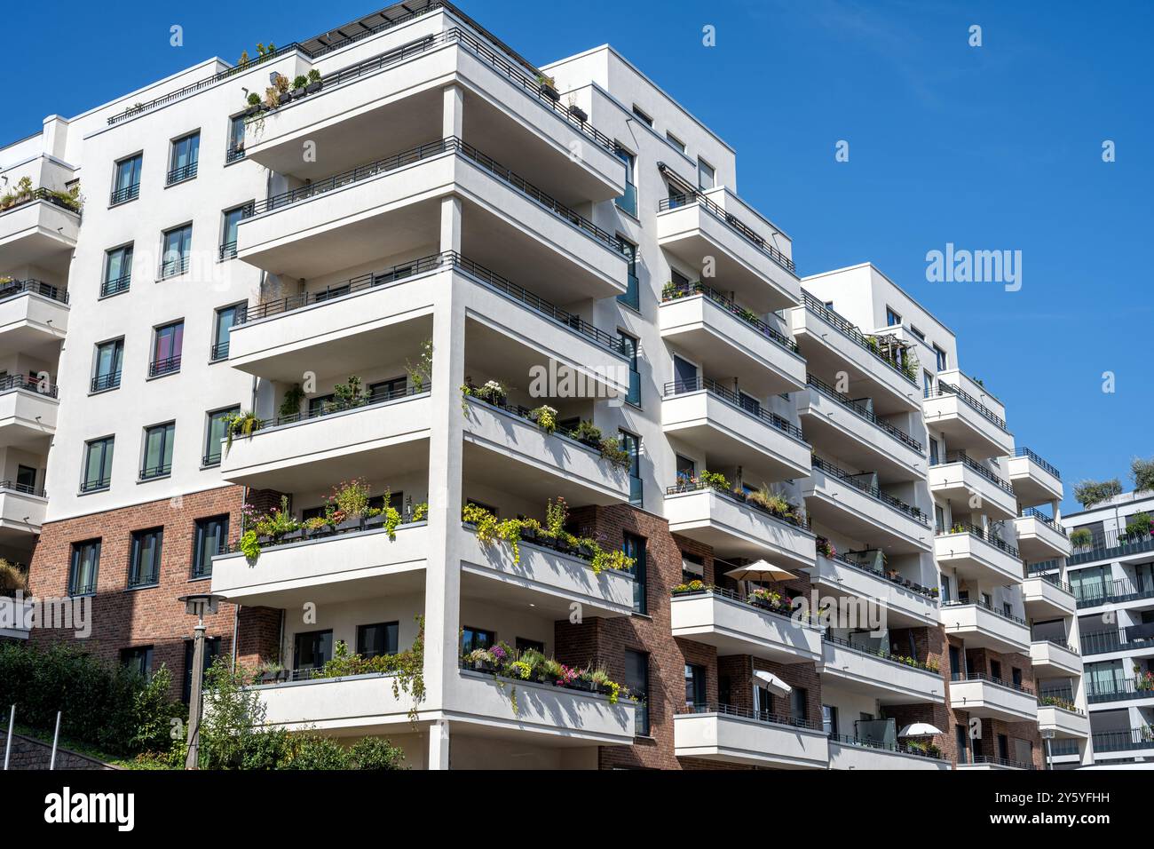 Modern white apartment building with large balconies seen in Berlin ...