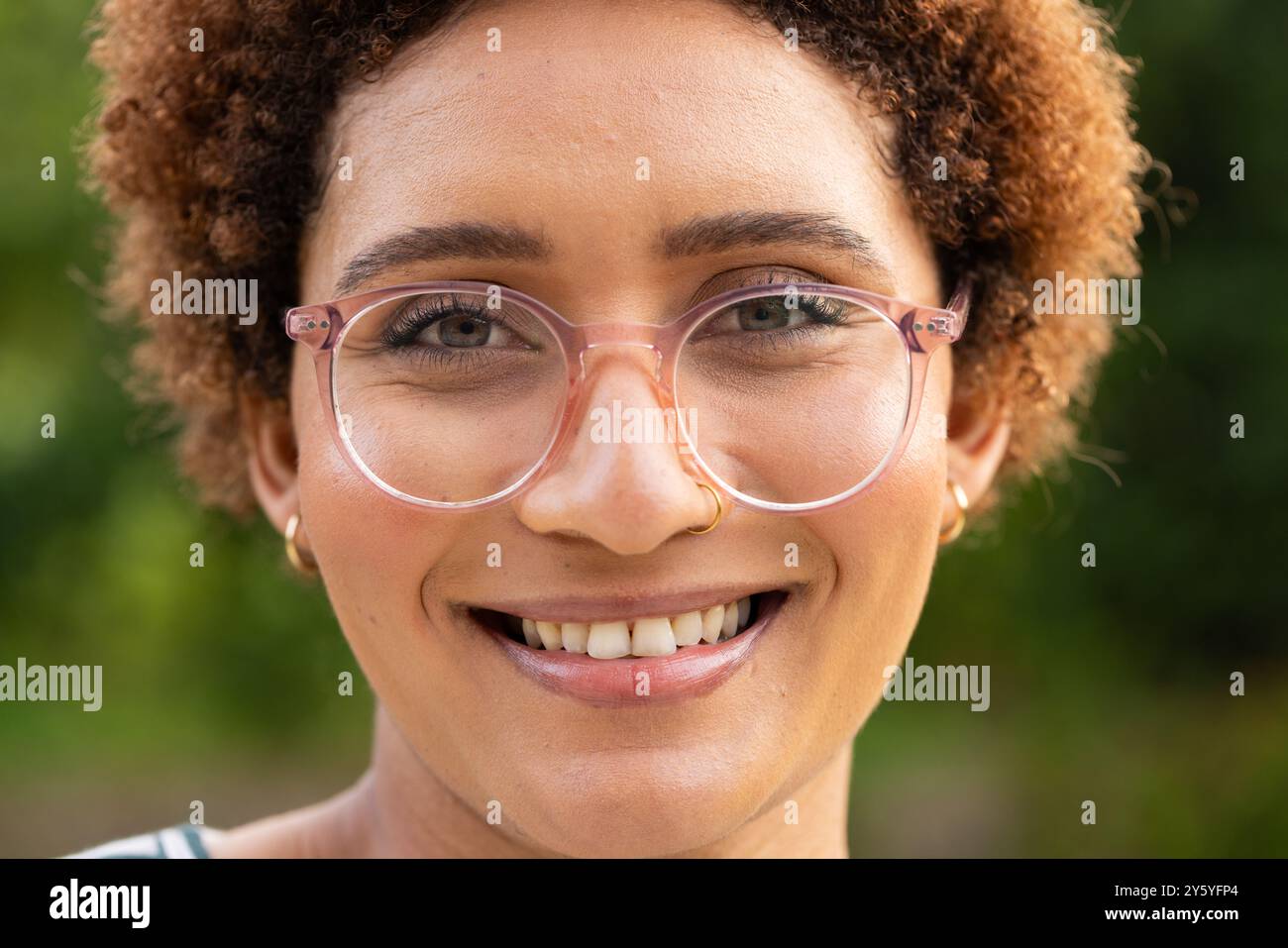 Woman curly hair glasses hi-res stock photography and images - Alamy