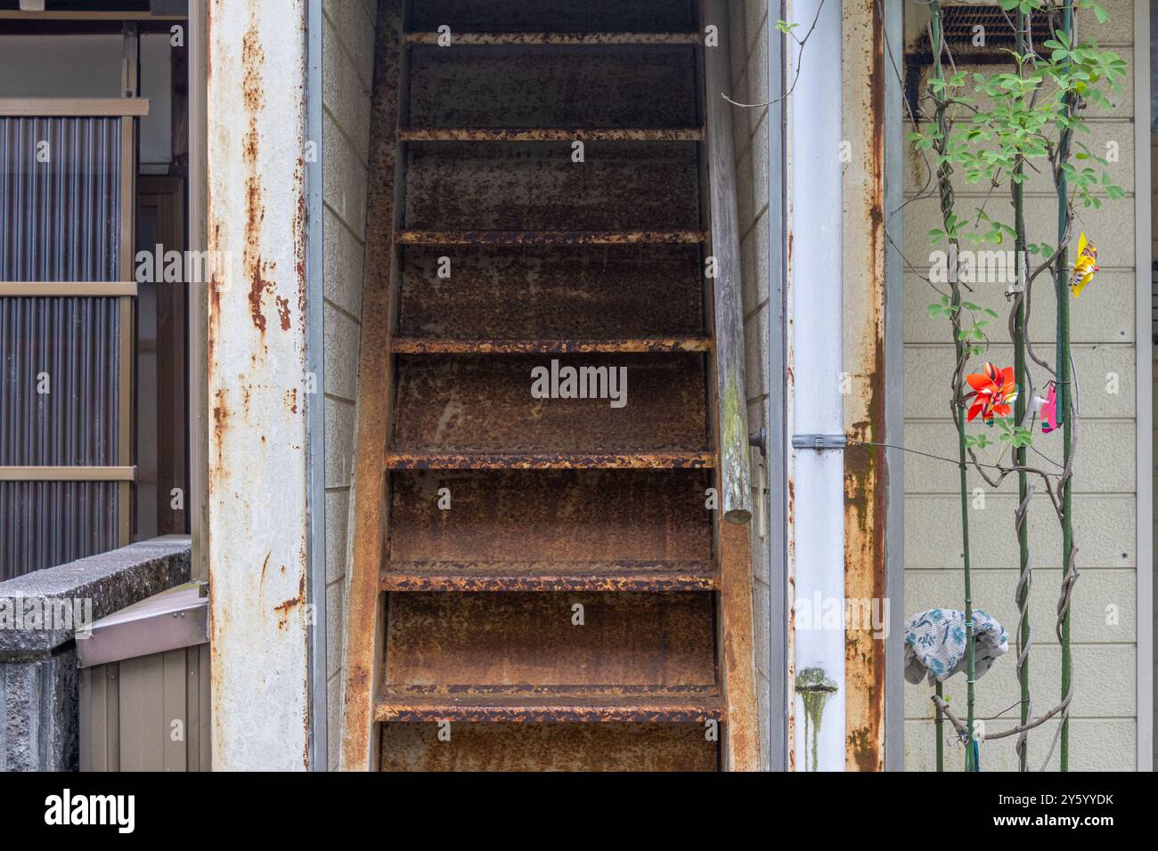 Rusted metal staircase at abandoned house, or akiya, Kanazawa, Ishikawa ...