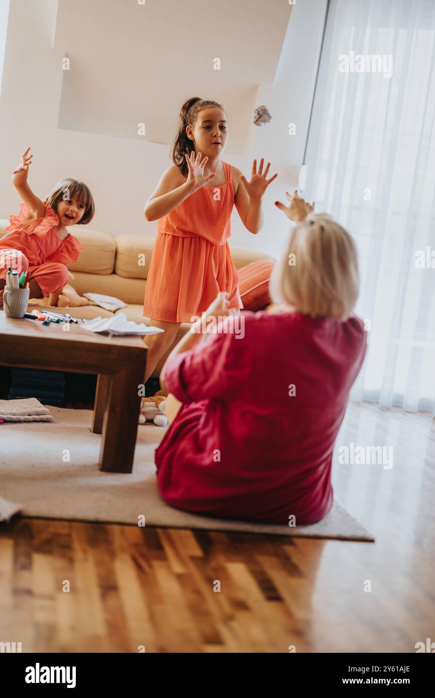 Family bonding time with children playing in a cozy living room Stock ...